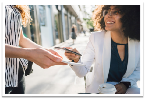 Woman purchasing coffee with cellphone
